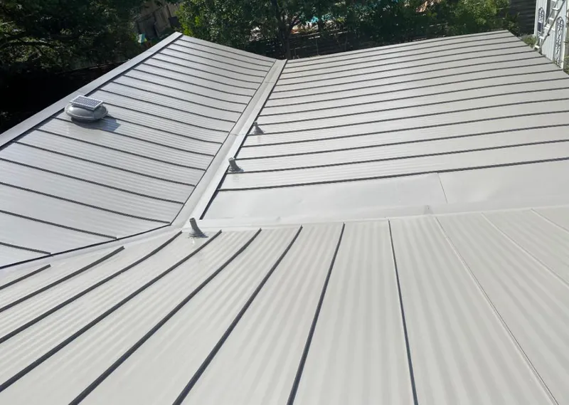 Solar attic fan installed on a metal roof for Roof Ventilation in Cupertino